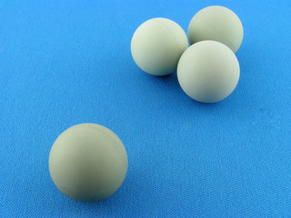 Spheres on a blue background. A close up.