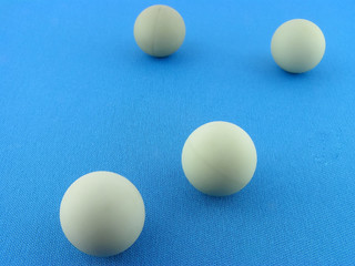 Spheres on a blue background. A close up.