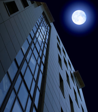 administrative building and moon in the night