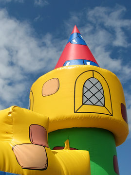 Bouncy Castle Tower With Cloudy Blue Sky