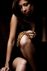 young woman with pearls