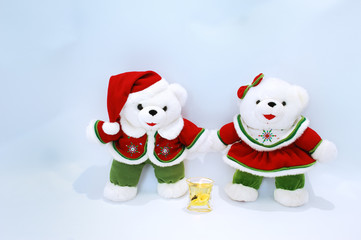 Christmas bears with candle  on light blue background