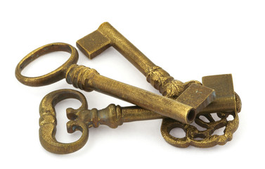 three ornamented old keys isolated on white background