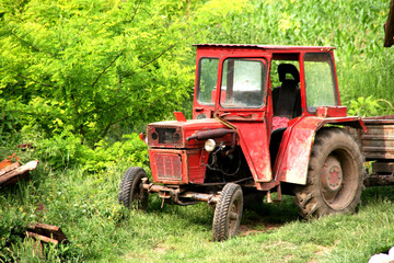 old farm tractor may be still in use, but very rusty