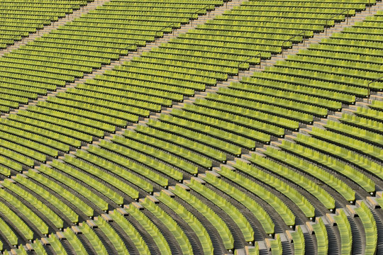 Empty green seating at an event - Powered by Adobe