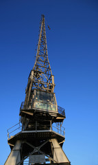 dockside crane against a clear blue sky