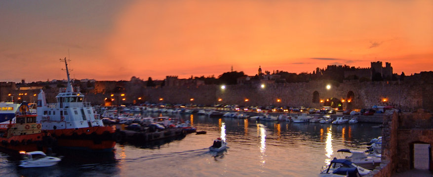 Old City Harbour Of Rhodes Greece At Sunset