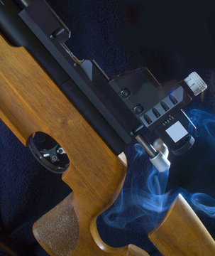 competition rifle with smoke