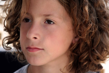 young boy with curly hair