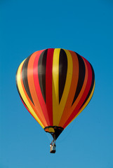 Colorful Hot Air Ballons in flight over clear blue vermont sky