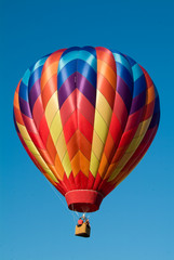 Ascending Colorful Hot Air Balloon into a clear vermont sky
