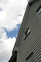 looking up at a white picket house
