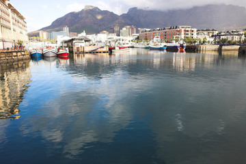 Fototapeta na wymiar Cape Town waterfront harbor with three boats 