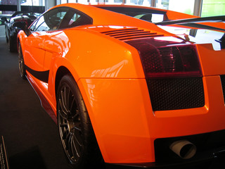 side of orange supercar