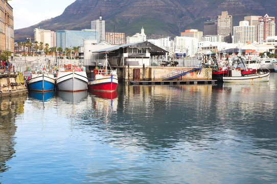 Cape Town waterfront harbor with three boats 