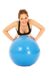 Isolated young adult Caucasian woman doing push-ups 