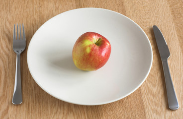 apple palced on a plate 