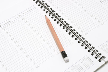 Closeup of Pocket Planner with Pencil