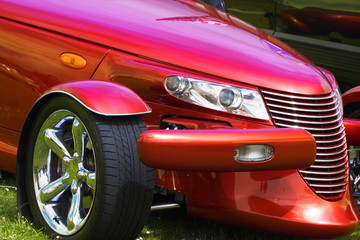 A close up photograph of a brightly coloured hot rod car - obrazy, fototapety, plakaty