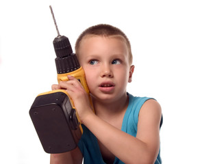 a boy is listening a sound of drill