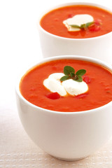 Roasted tomato and herb soup, with capsicum and yoghurt.