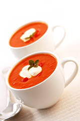 Tomato, roasted capsicum and herb soup, with yoghurt.  