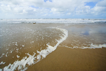 Sunny beach blue sky and golden sand