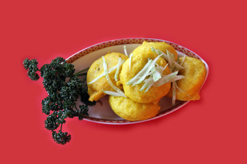 Middle Eastern dish isolated on red