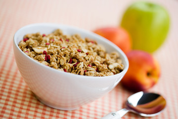 Breakfast cereal with dryed fruits and fresh peaches
