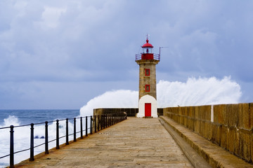 Fototapeta na wymiar Roker lighthouse and pier after a storm