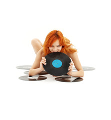 playful redhead with vinyl records over white