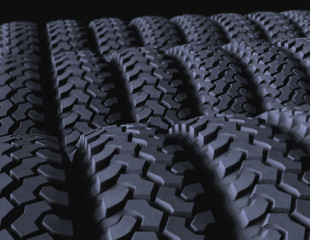 Fototapeta premium Group of 3d rendered tires on a black background