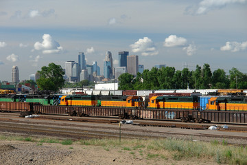 Train Yard overlooked by Minneapolis skyline