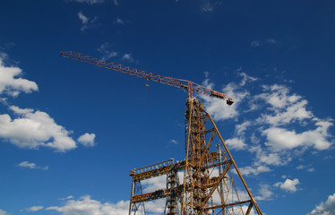 crane with dramatic clouds  in background