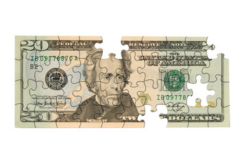 Twenty dollar bill with pieces missing isolated over white