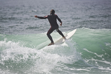 surfer on top of the wave