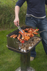 turning meat on barbecue