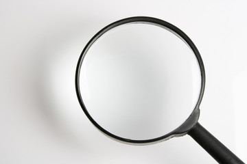 real    magnifying    glass    on   the     white     background