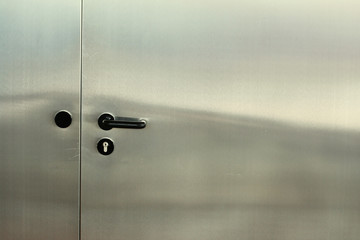 Metal door on modern office building. Entrance concept