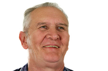 Mature man smiling looking to the left.