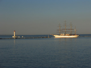 Retro schooner leaving a port