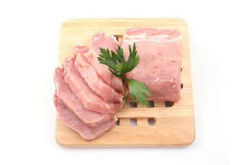 boneless pork loin on board - isolated on white
