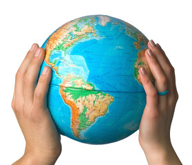 Hands of man and woman hold globe on white background