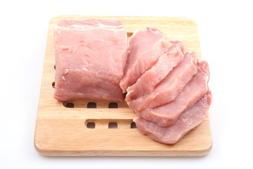 boneless pork loin on board - isolated on white