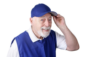 A senior man working as a greeter tips his hat 