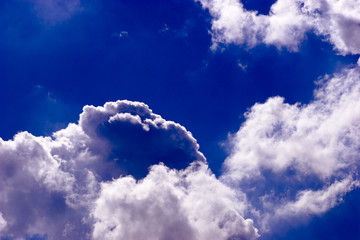 Dramatic magestic vivid cloudscape in deep blue skyes