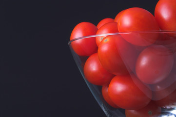 Small grape tomatoes in a martini glass.