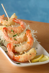 Tempura Jumbo Shrimp skewer on table with fried rice pasta