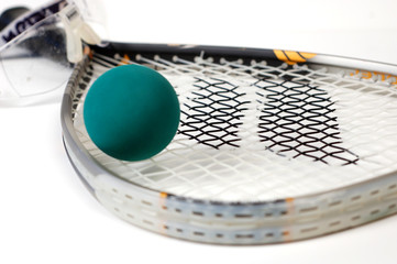Close up shot of racquetball gear on a white background.