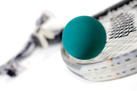 Close up shot of racquetball gear on a white background.